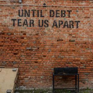 Brick wall with graffiti words 